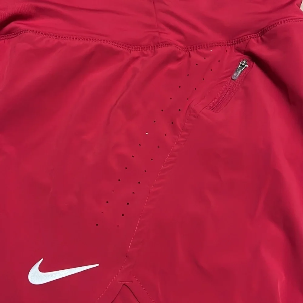 Nike raspberry colored Dri-Fit running shorts, medium, new